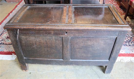 An oak coffer with panelled front, width 105cm, depth 55cm, height 65cm